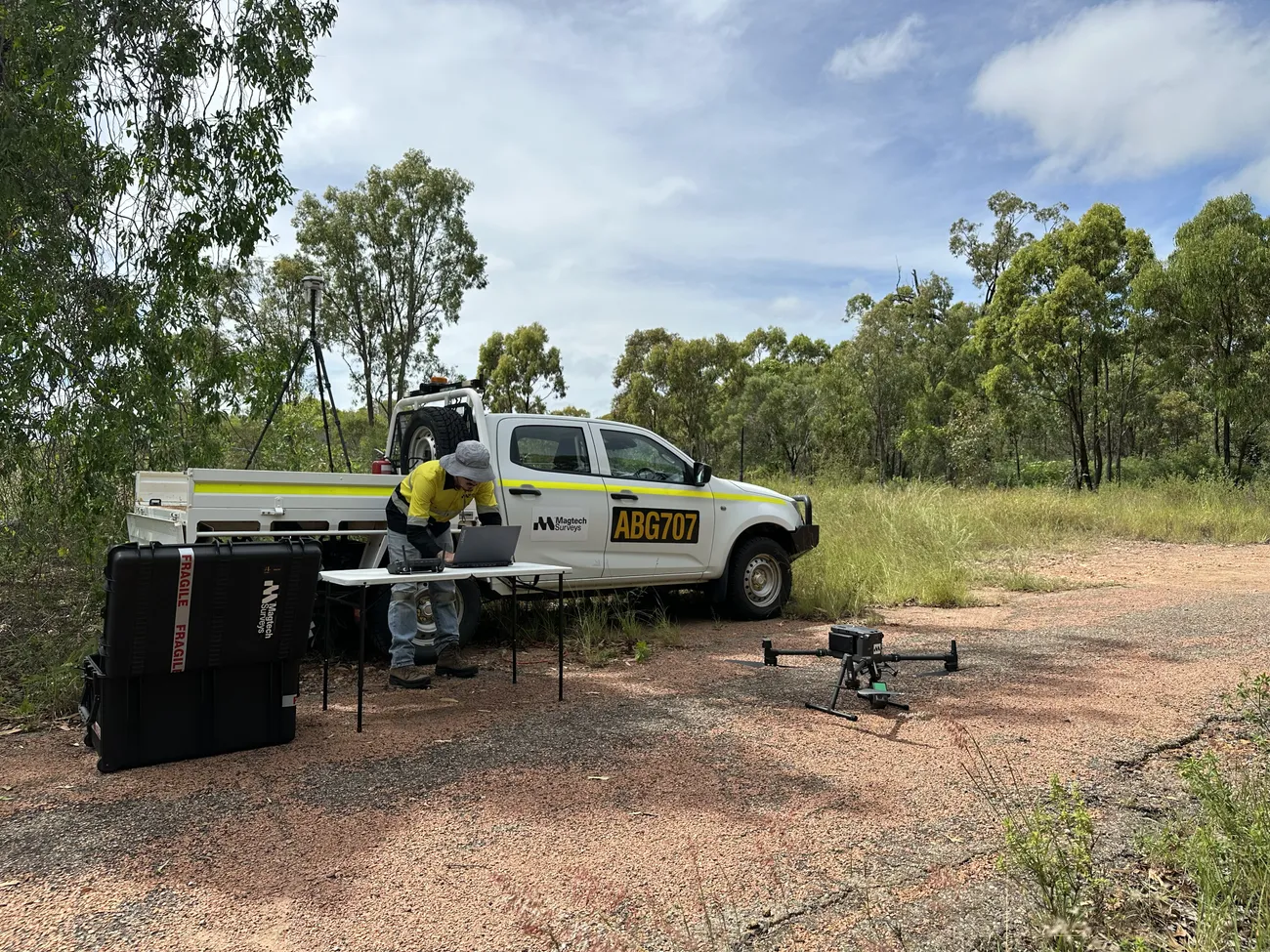Drone and LiDAR payload set up beside the survey vehicle in the field